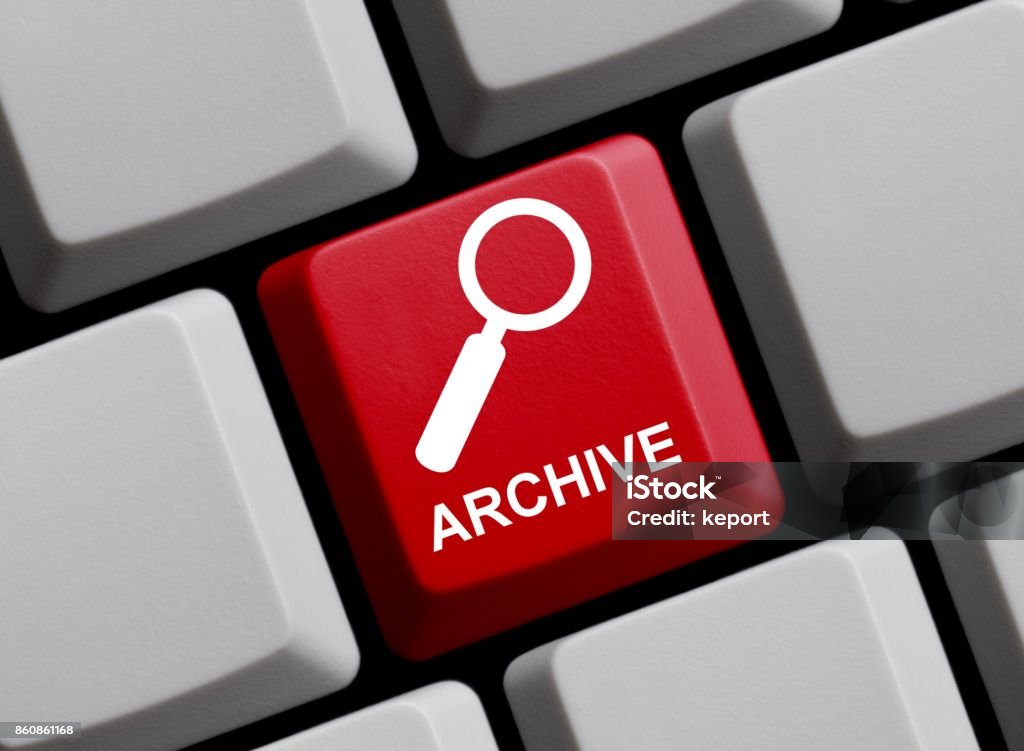 Computer Keyboard: Archive online Red Computer keyboard with white magnifier symbol showing Archive Business Stock Photo