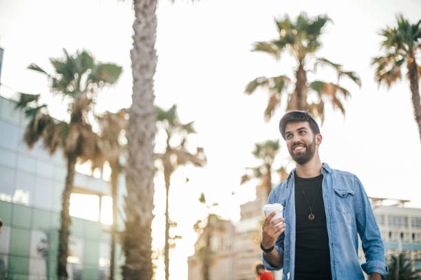 istock Man standing on the street with coffee cup 860863508