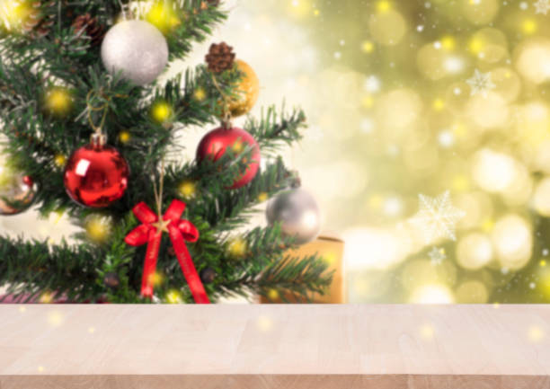 istock wood table with christmas tree decorations and snowflake on gold bokeh background. for Happy New Year 2018 860864354