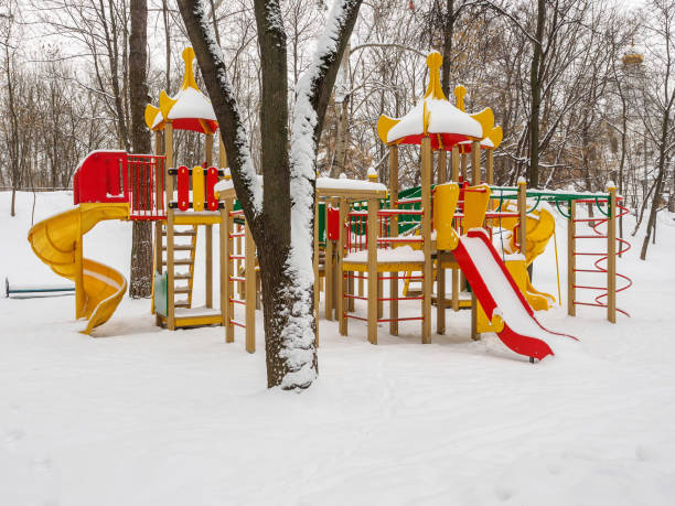 istock Snowy colorful playground in a park in winter. 860865132