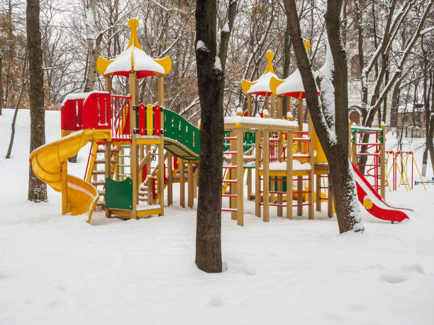 istock Snowy colorful playground in a park in winter. 860865270