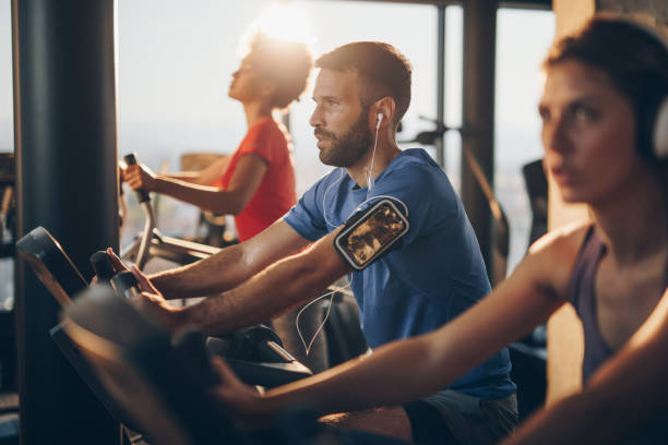 istock Athletic man listening music while exercising on exercising class in a gym. 860865474