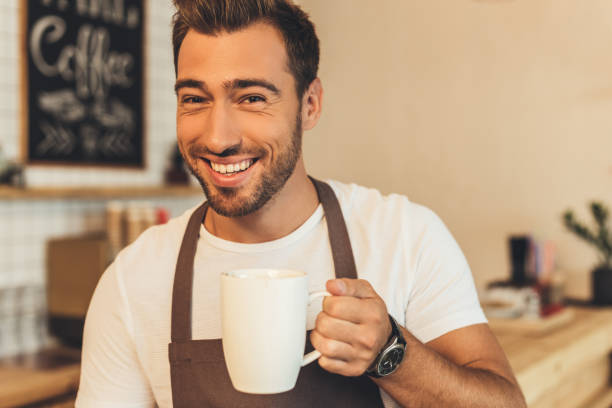 istock barista with cup of coffee 860879932