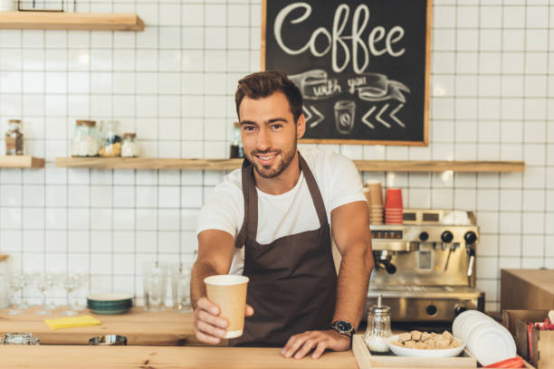 istock barista with coffee to go 860880584