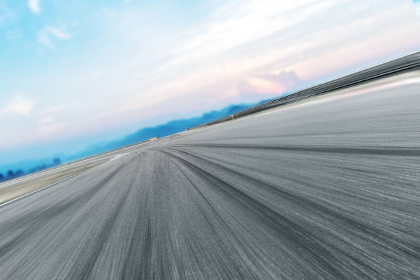 istock empty asphalt road with modern city near long river 860881134