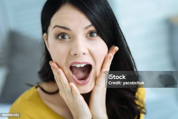 Surprised Girl Keeping Her Mouth Wide Opened Stock Photo - Download Image Now - Adult, Adults Only, Appearance