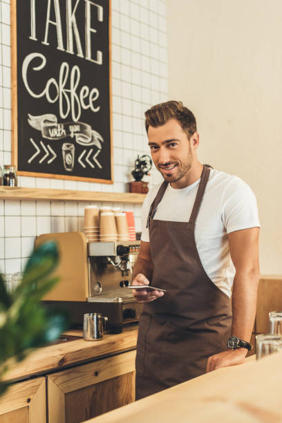 istock barista with smartphone 860886954