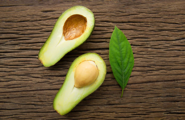 istock Avocado on a brown wood background. 860887764