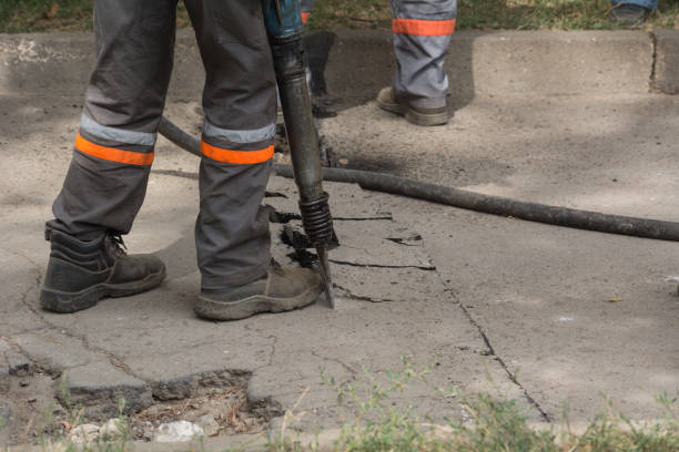 istock Road repairing works with jackhammer 860888844