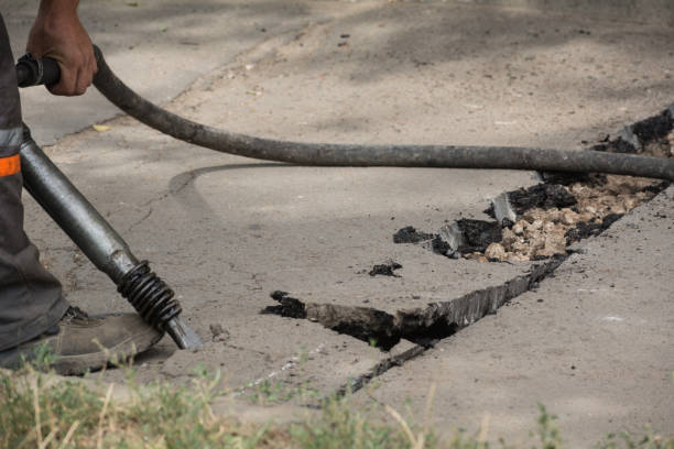 istock Road repairing works with jackhammer 860888898