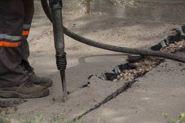 istock Road repairing works with jackhammer 860888914