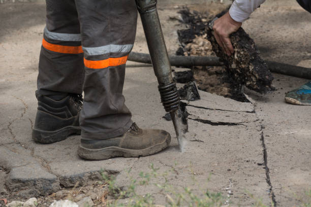 istock A male worker removes the asphalt with his hands 860888930
