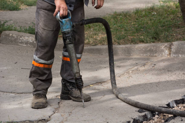 istock Road repairing works with jackhammer 860889000