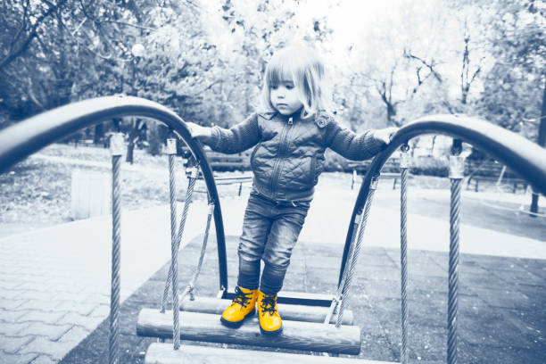 istock Little child on playground 860891422