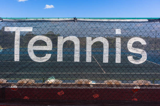 Tennis word sign decor netting on courts outdoors closeup abstract photo.