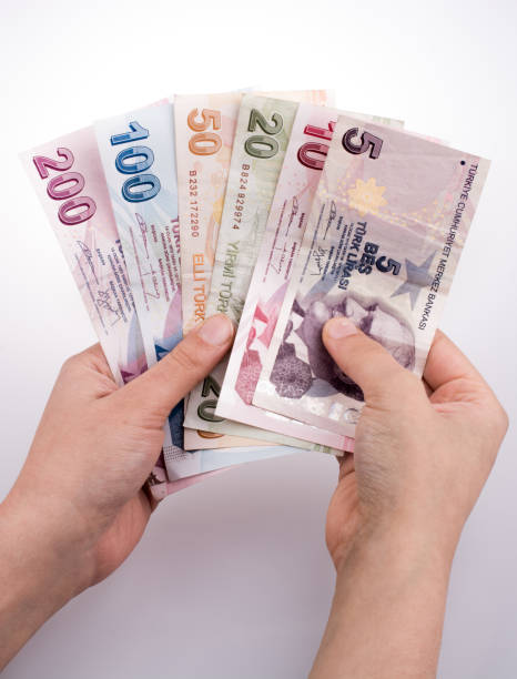 istock Hand holding Turksh Lira banknotes  in hand 860899164