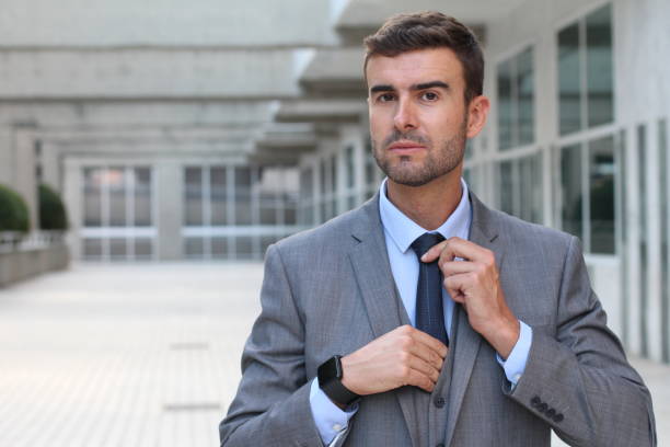 istock Boastful businessman adjusting his tie 860899910