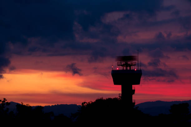 Rotating antenna secondary surveillance radar with twilight sky at sunset time Rotating antenna secondary surveillance radar with twilight sky at sunset time prison guard stock pictures, royalty-free photos & images