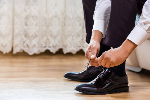 istock The groom cords the laces wedding 860907256