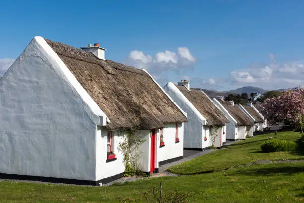Old traditional houses in Connemara, County Galway. The photo was taken at daytime in springtime.