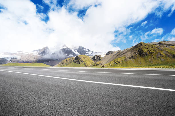 istock empty asphalt road with beautiful snow mountain 860910504