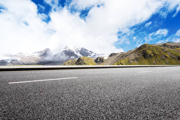 istock empty asphalt road with beautiful snow mountain 860911334