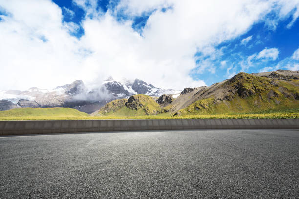 istock empty asphalt road with beautiful snow mountain 860912194