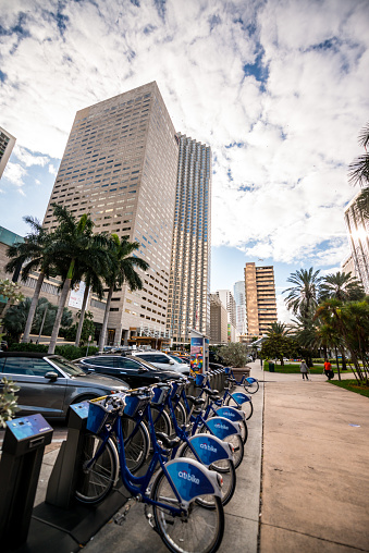 Miami, USA - December 22, 2016: Bicycle sharing system bike station in front of the entrance to the InterContinental Hotel in Miami downtown