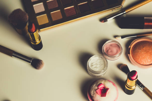 istock beauty concept : cosmetics top view on a white table. Workplace, cosmetic bag 860915424