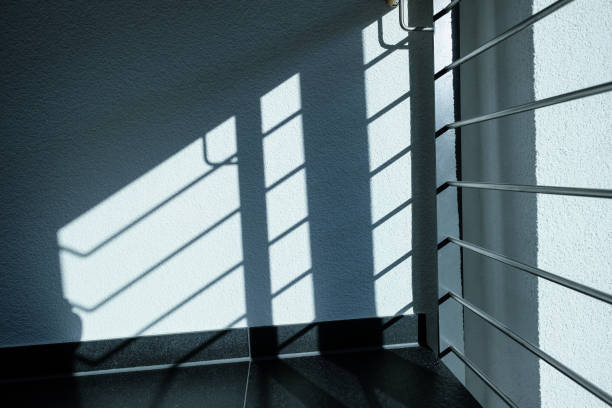 istock Railings in stair as shadow on the wall 860919646