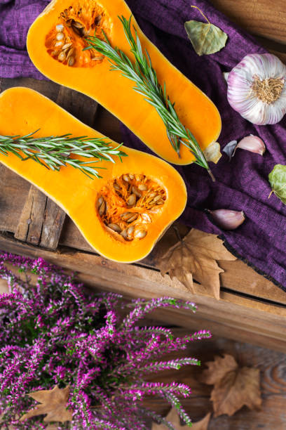 istock Fall autumn harvest background with butternut squash pumpkin and rosemary 860920324