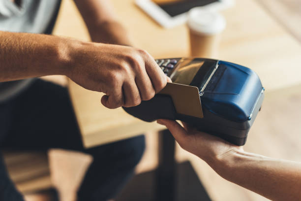 istock man paying with credit card 860926974