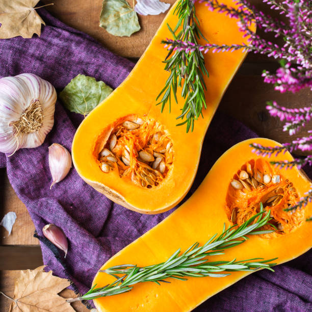 istock Fall autumn harvest background with butternut squash pumpkin and rosemary 860930994