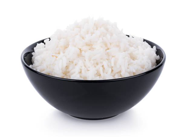 ライスのボウル、白背景 - brown rice rice healthy eating organic ストックフォトと画像