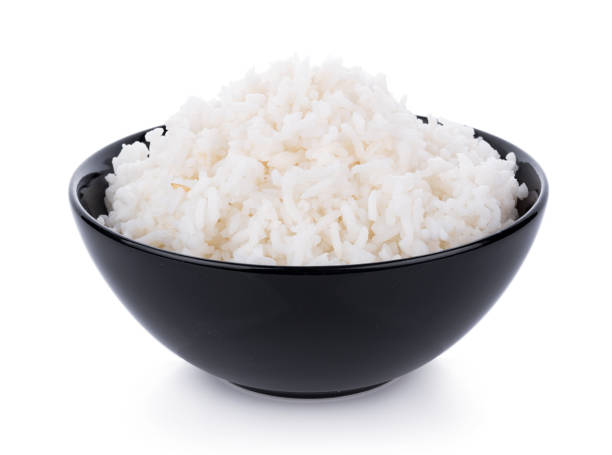 Rice in a bowl on a white background Rice in a bowl on a white background steamed stock pictures, royalty-free photos & images