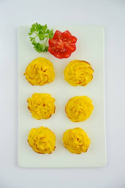 Duchess potatoes Duchess potatoes garnish with tomato and parsley duchess photos stock pictures, royalty-free photos & images
