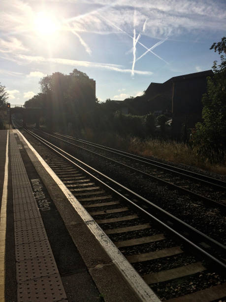 istock Waiting for the train on platform at sunrise 860935212