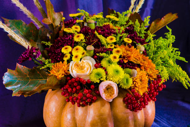 istock Bouquet for Halloween in a vase from pumpkin. 860936080