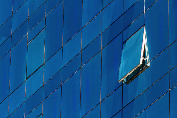 istock Single open window of a glazed office building 860948296
