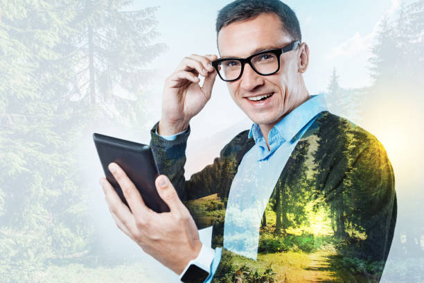 istock Pleasant look of a cheerful manager with a tablet 860950768