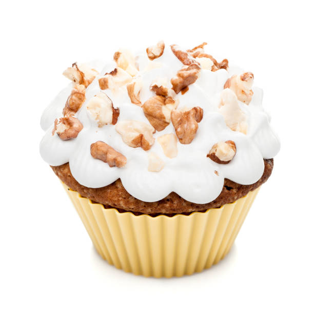 istock cupcake muffin with cream and nuts isolated at white background 860951362