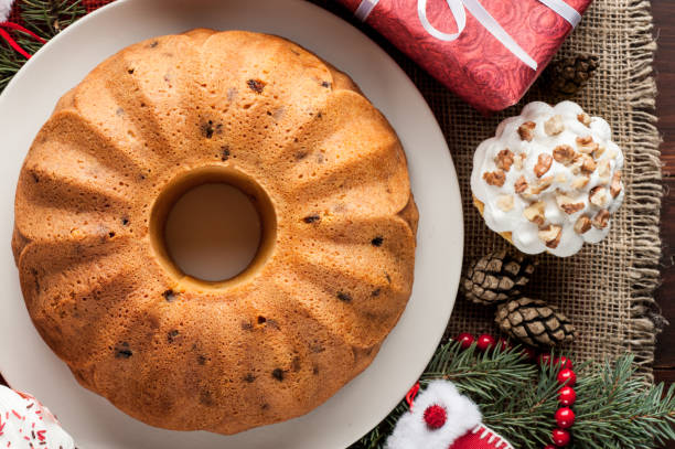 istock christmas decorated cupcakes and cake at red burlap background top view 860953978