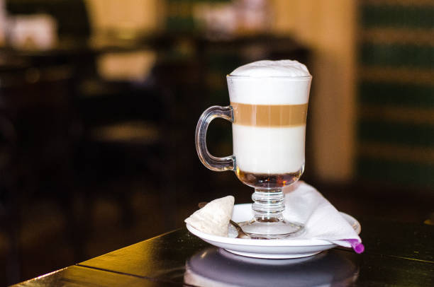Cup of coffee latte in coffee shop. Latte in glass on the tabli in caffe