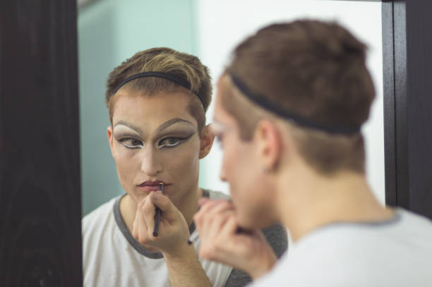 istock Man gets dressed in drag attire in bathroom 860962310