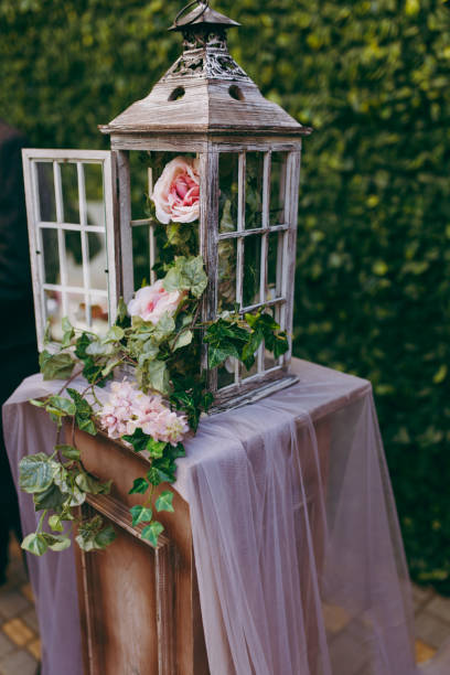 istock Lantern decorated with flowers at the wedding ceremony 860962682
