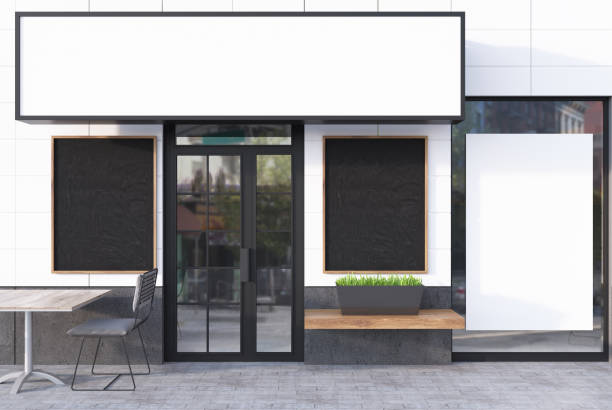 istock White cafe exterior with four posters 860966138