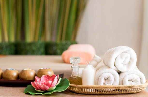 istock White towels and Spa objects on Spa Massage bed 860969278