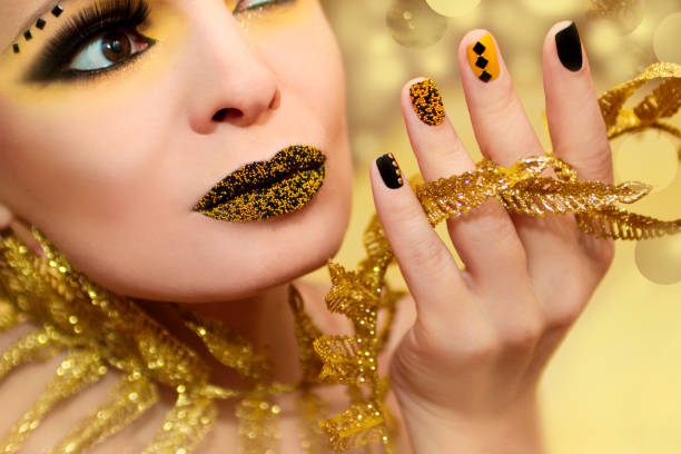 istock Yellow black manicure and makeup. 860969666