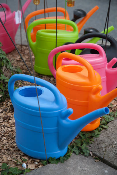 istock Watering cans in various colors 860970586
