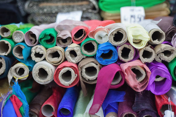 istock Rolls of colorful clothing material 860976544